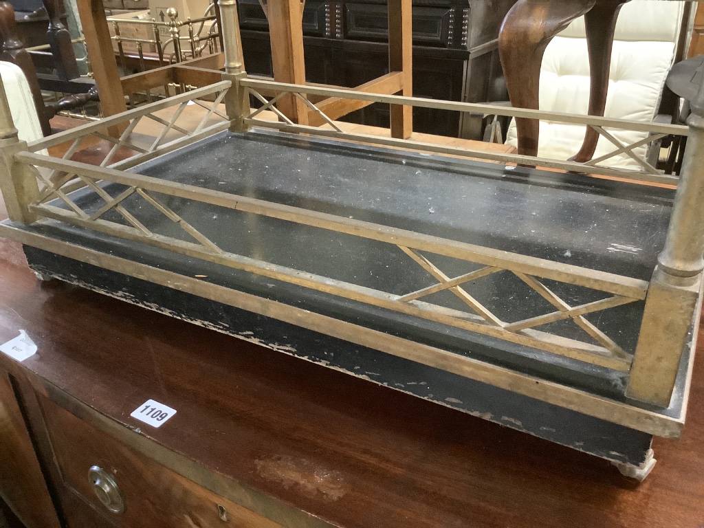 An ebonised brass and lacquer drinks trolley, width 77cm, depth 44cm, height 66cm